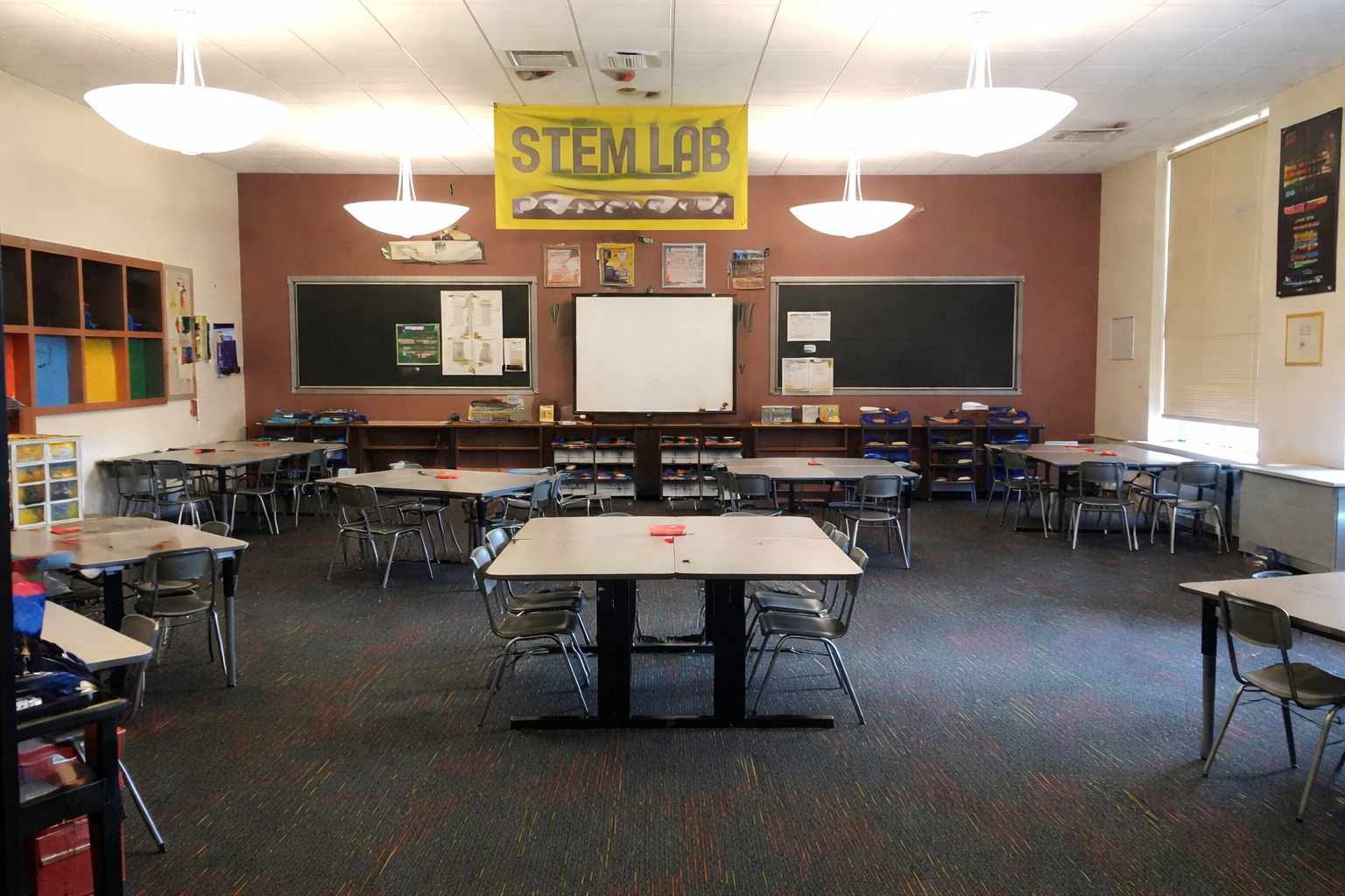 Facilitators collaborating in a lab environment